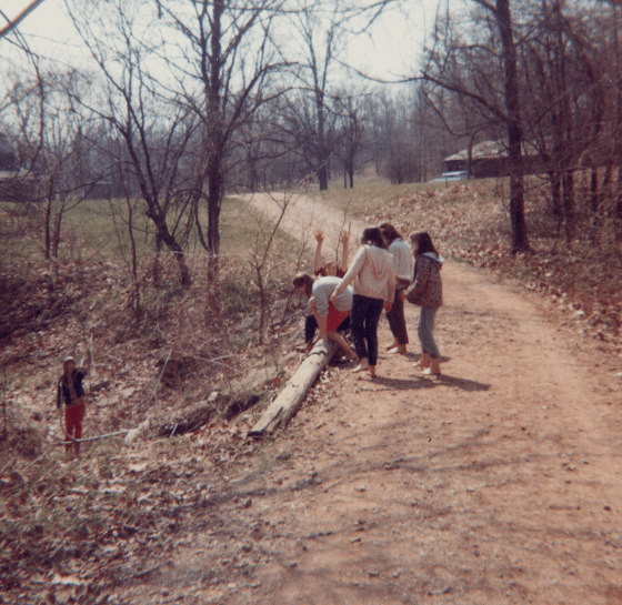 1960s photo of group of girls walking on a trail