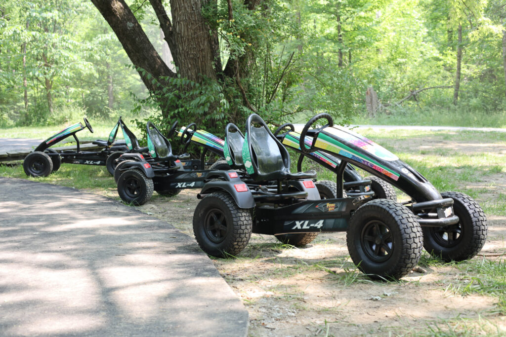 Pedal cars lined up outdoors